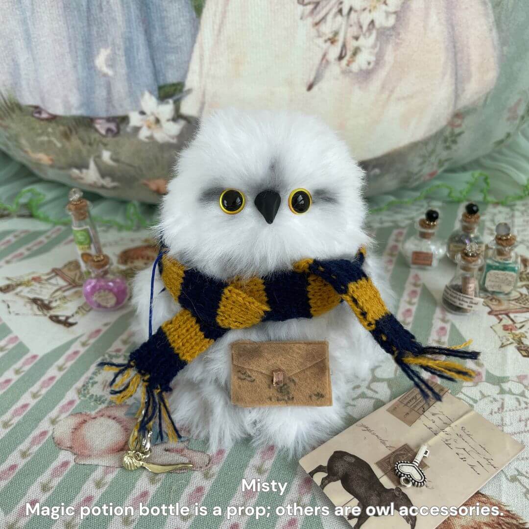 Fluffy Magic Owls handmade snowy owl figurine with golden eyes, red and gold scarf, carrying a mail satchel.
