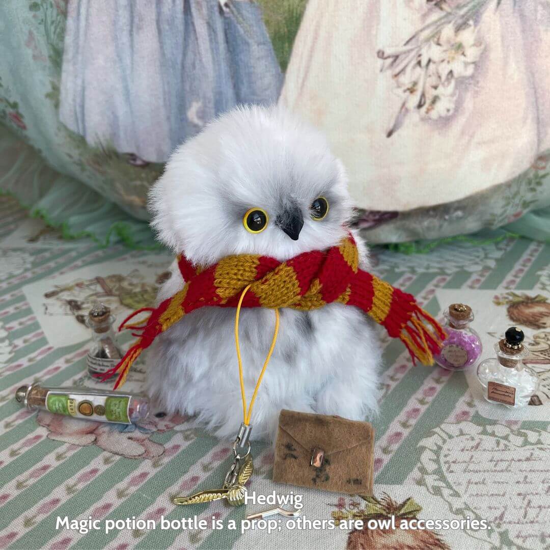 Fluffy Magic Owls - handmade miniature snowy owl wearing a red and gold scarf, golden eyes, with tiny mail satchel and prop potion bottles.