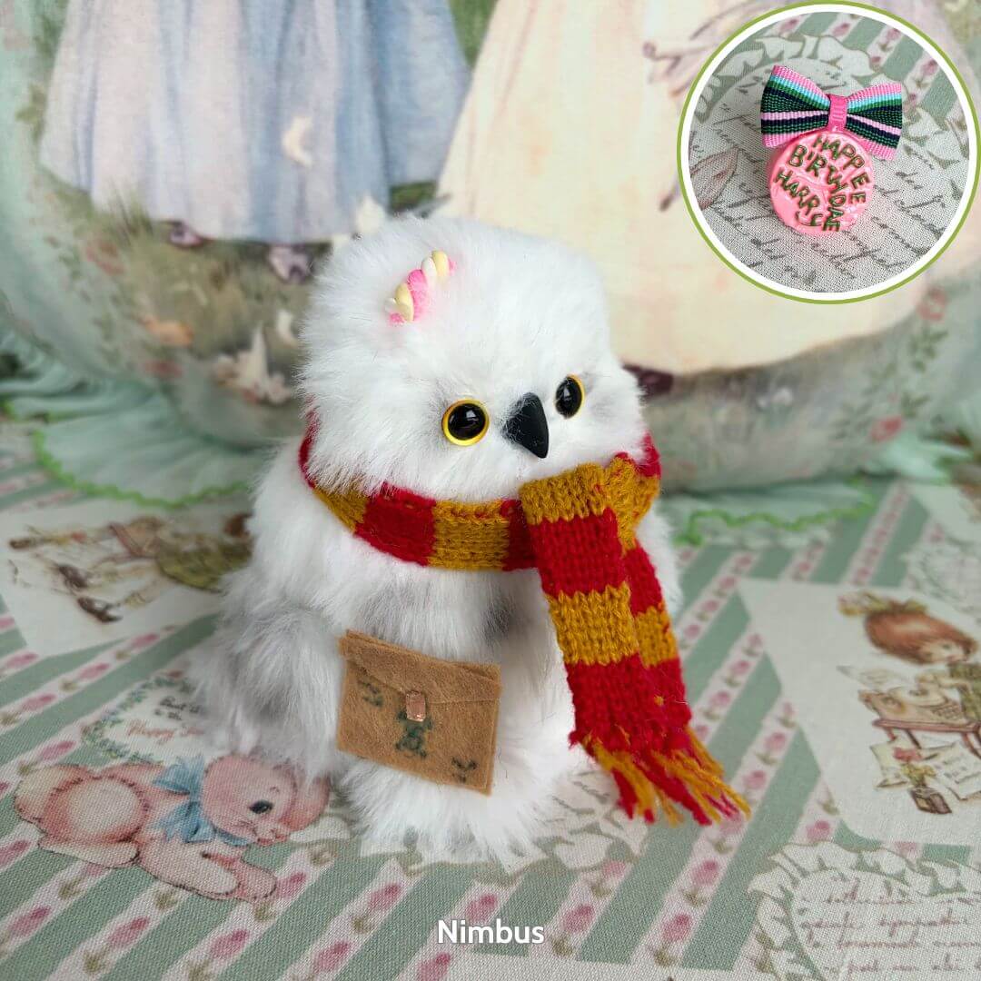 Fluffy Magic Owls: adorable white owl figurine with golden eyes, wearing a red and yellow scarf, holding a mail satchel. Handmade in UK.