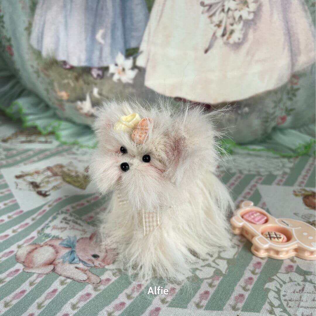 Fluffy Puppy Collection featuring a handmade fluffy toy dog with a bow, sitting on a pastel-themed decorative background.