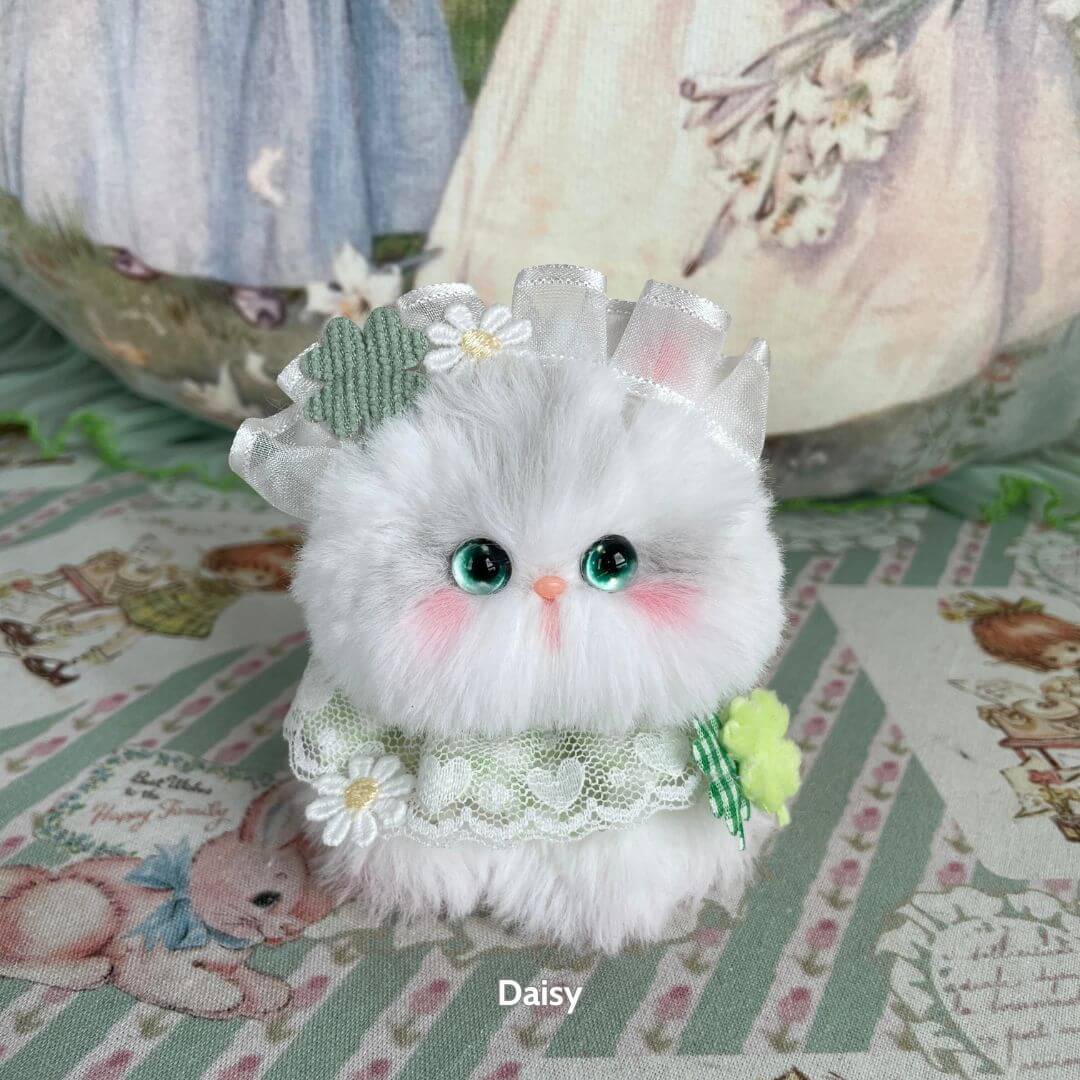 Adorable handmade kitten from the Blossom Kitten Collection, fluffy with mint lace, floral accents, and charming personality.