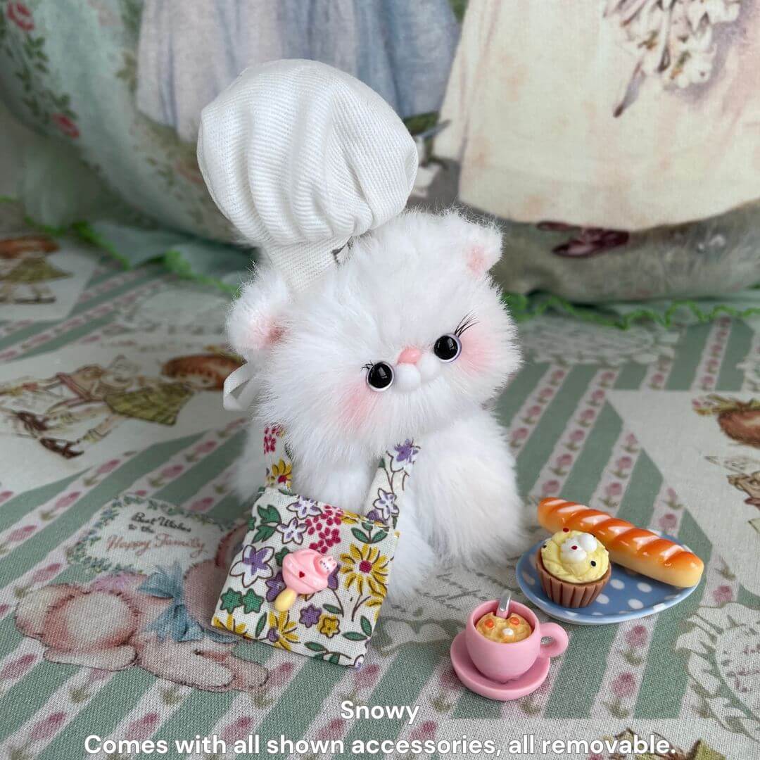 Purrfect Chef Kitten Sets featuring a fluffy white kitten in a chef hat and apron, with miniature cooking tools and plated treats.