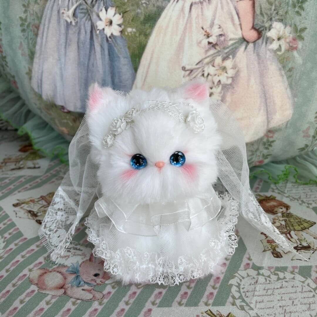 Fluffy white kawaii kitten figurine in veil and lace dress, themed 'Enchanted Wedding of Mr. & Mrs. Paws', handmade in UK.