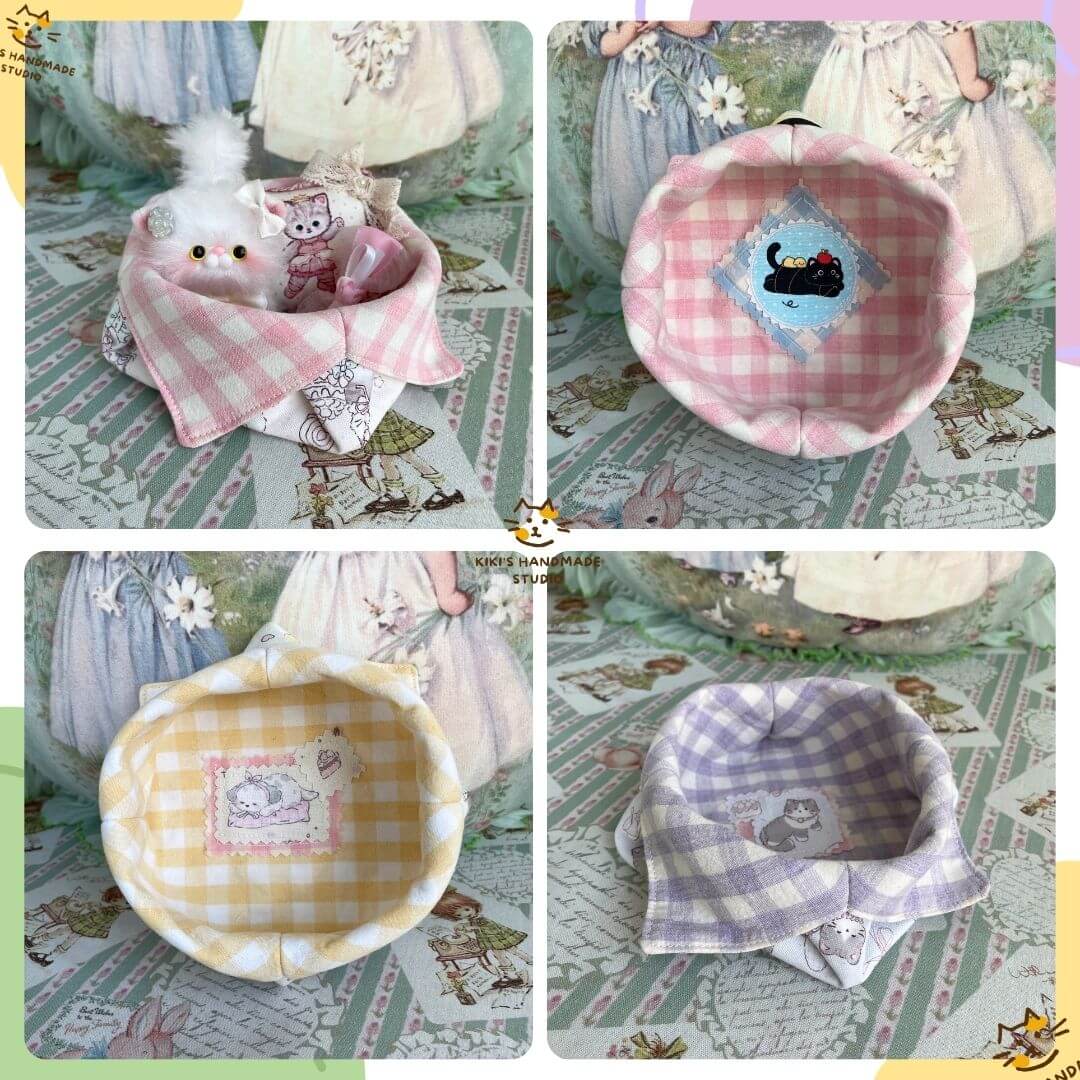 Gingham Cat Catch-All Tray in pastel pink, yellow, and purple with cute stitched kitten designs and soft fabric for collectibles.