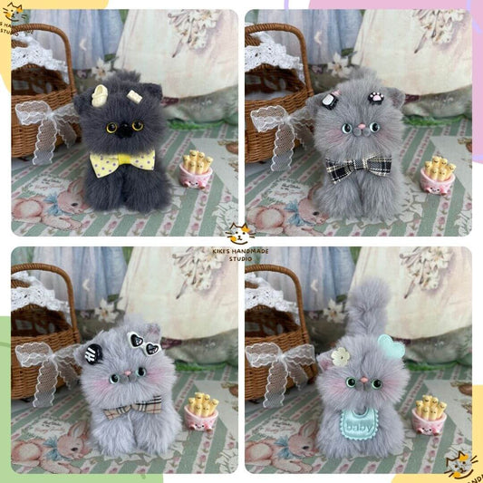 Handmade grey kitten plush toys with whimsical accessories, crafted in the UK. Includes bows, berets, and cupcakes, ideal for decoration.