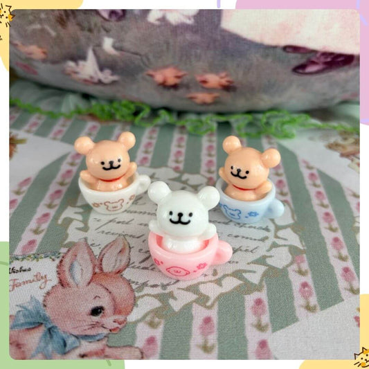 Tiny Puppy Cup with three cute bear figures in pastel colors, peeking out of cups, perfect for whimsical decor.