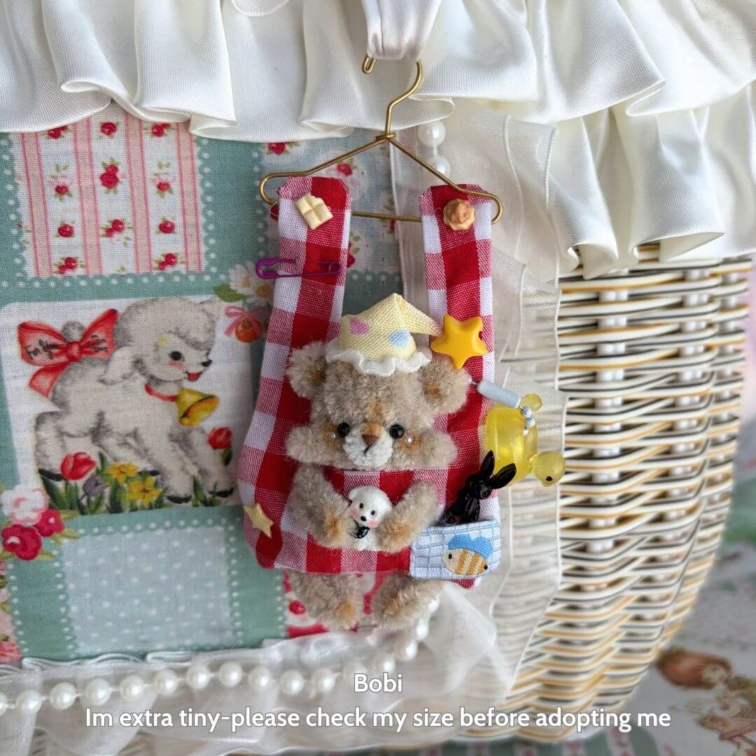 Little Hanger Pals tiny handmade bear figurine in a red-checkered outfit, cheerful expression, perfect for cozy decor.