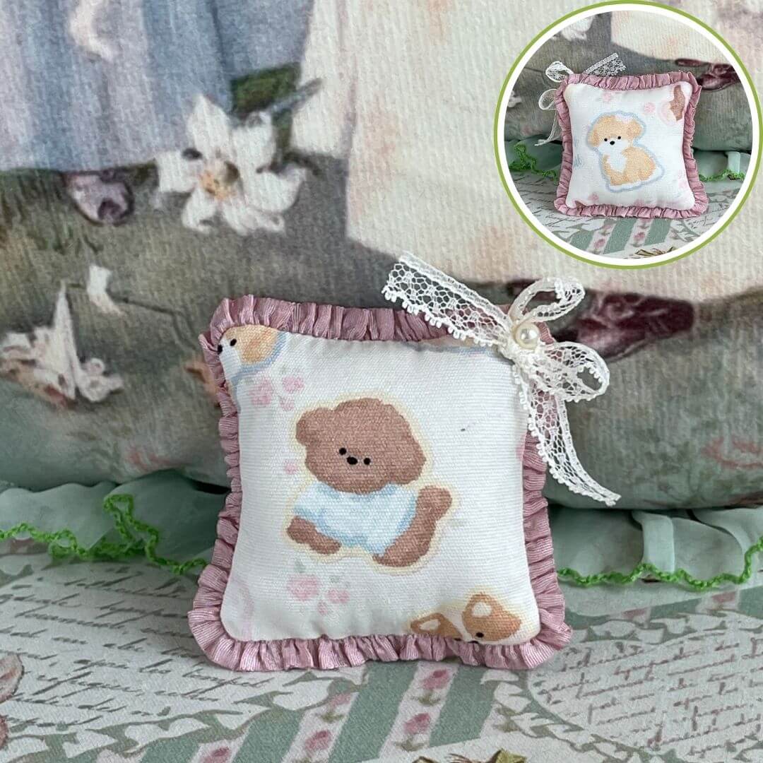 Handmade cuddle critter cushion with a delicate hand-stitched bow, featuring a cute puppy design. Ideal plush toy accessory or decor.