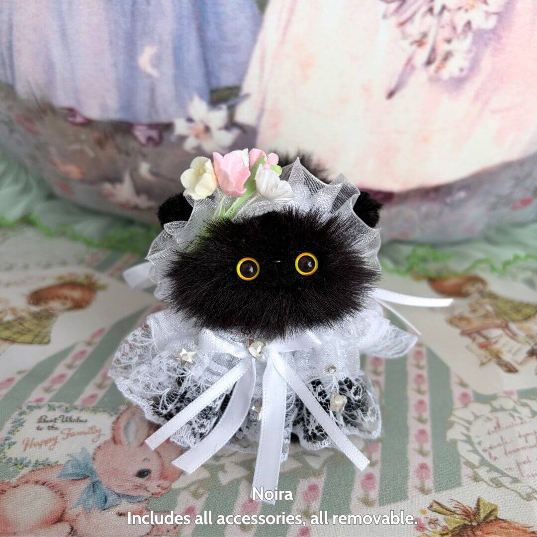 Handmade kitten from Petals & Whispers Collection, fluffy black cat figurine dressed in lace with floral accents.