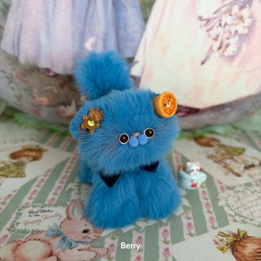 Cute blue fluffy kitten figurine with fruit-themed accessories, part of the Fruity Kitten Collection, showcasing kawaii style.