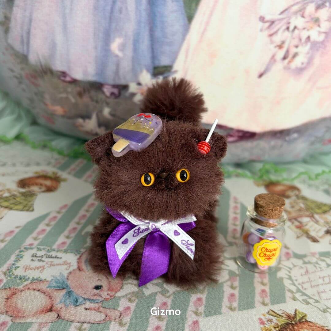 Brown Kitten Collection: fluffy brown kitten figurine with ice cream accessory and violet ribbon, cute kawaii style collectible.