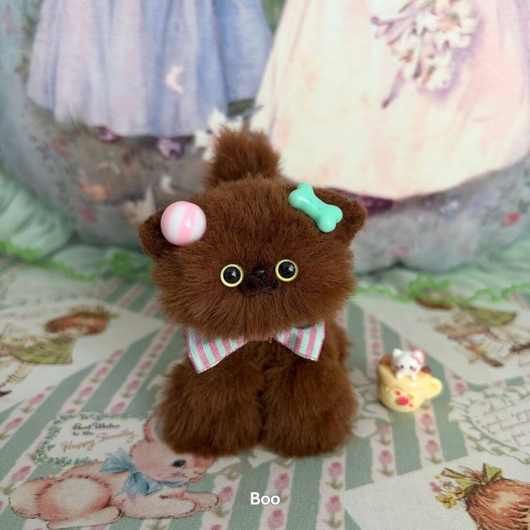 Handmade kitten from the Brown Kitten Collection, a fluffy chocolate brown cat figurine with dessert-themed accessories.