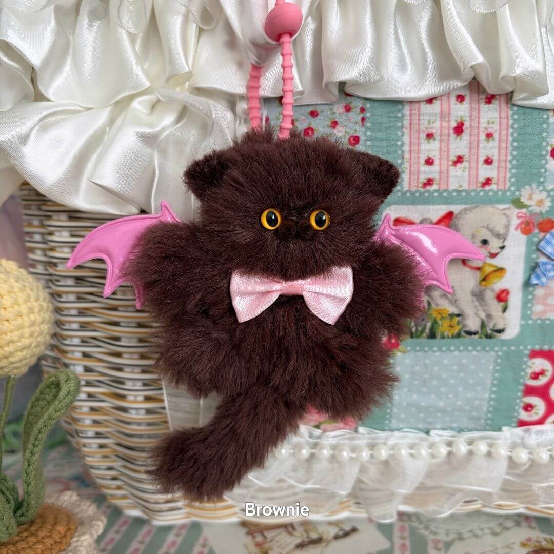 Winged Kitty Pendants featuring a fluffy brown kitten with pink wings and a cute bow tie, handmade collectible from the UK.