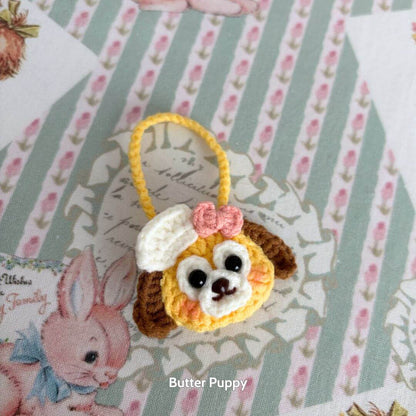 Snuggle Bits: Cute handmade miniature kitten figurine with a fluffy puppy design and pink bow, perfect for collectible decor.