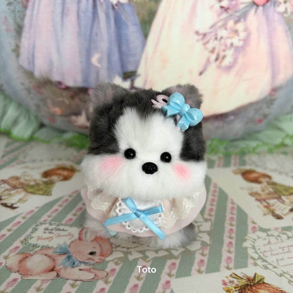 Handmade puppy from the Cosplay Puppy Collection, featuring fluffy fur, a pastel blue bow, and a sweet expression.