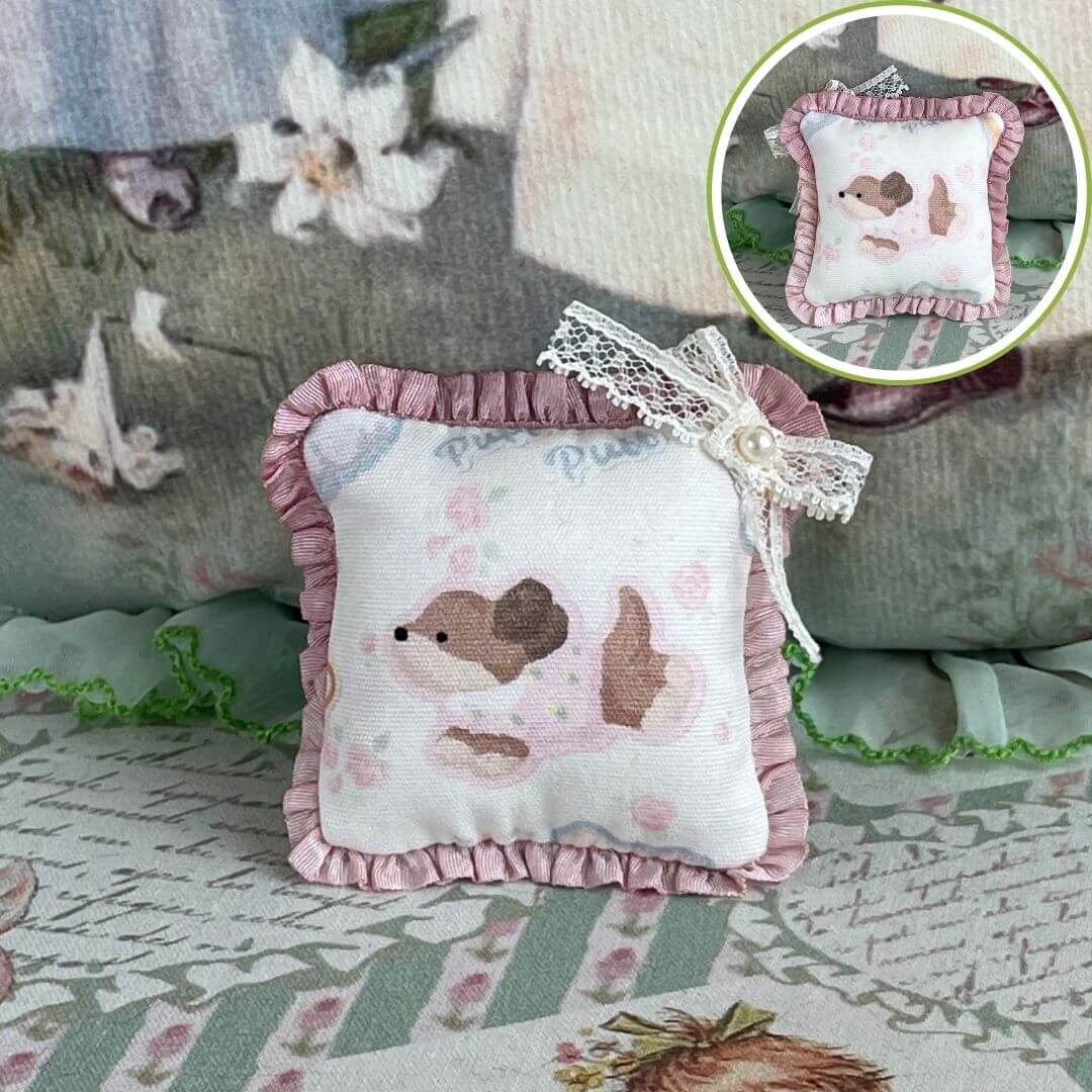 Handmade Tiny Cuddle Critter Cushion with dog design, pink ruffle trim, and bow detail; perfect plush toy or decorative desk accessory.
