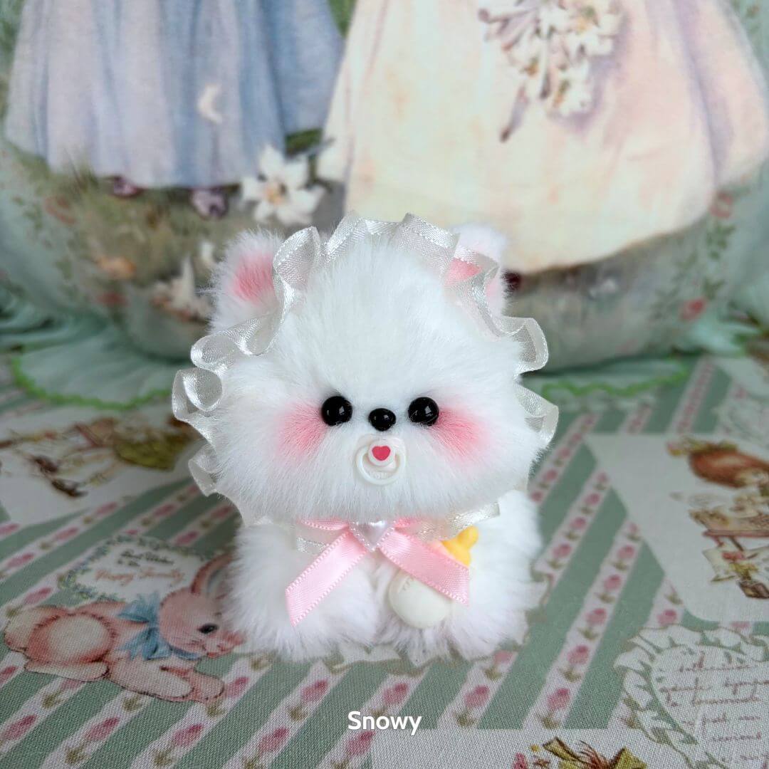 Cosplay Puppy Collection: fluffy white puppy doll with pink ribbon, rosy cheeks, and cute expression, placed on pastel floral background.
