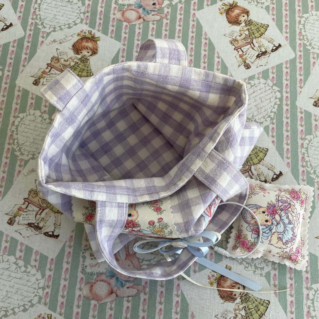 Interior of Handmade Dreamy Tote Bag with plaid lining and whimsical cat and squirrel pattern, ideal for carrying essentials.