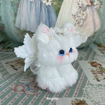Handmade white plush toy kitten with wings and lace, part of Enchanted Big Paws Collection, designed by Aiko from Kiki's Handmade Studio.