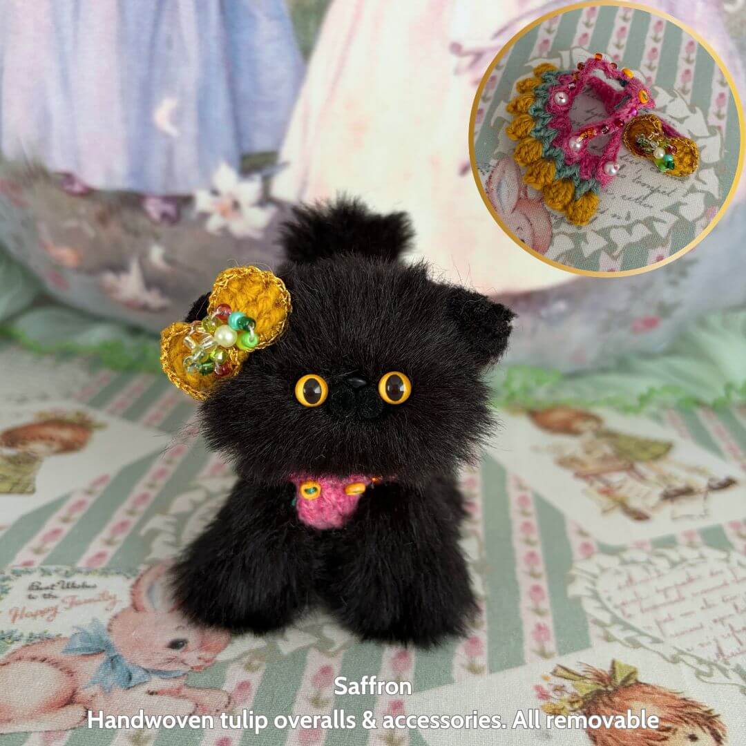Spring Love Limited Collection fluffy black handmade kitten dressed in colorful removable accessories and whimsical floral overall.