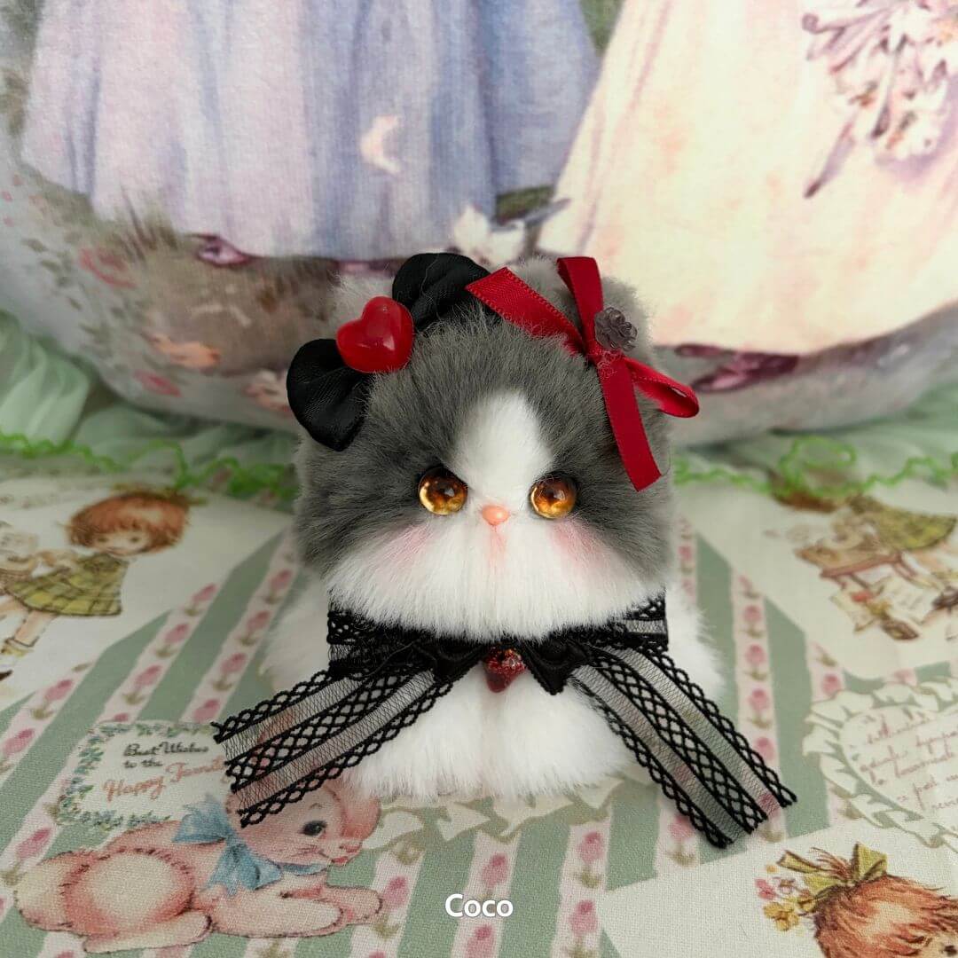 Adorable grey and white handmade kitten from the Fairy Paws Collection, featuring a heart and bow accessories, kawaii style.