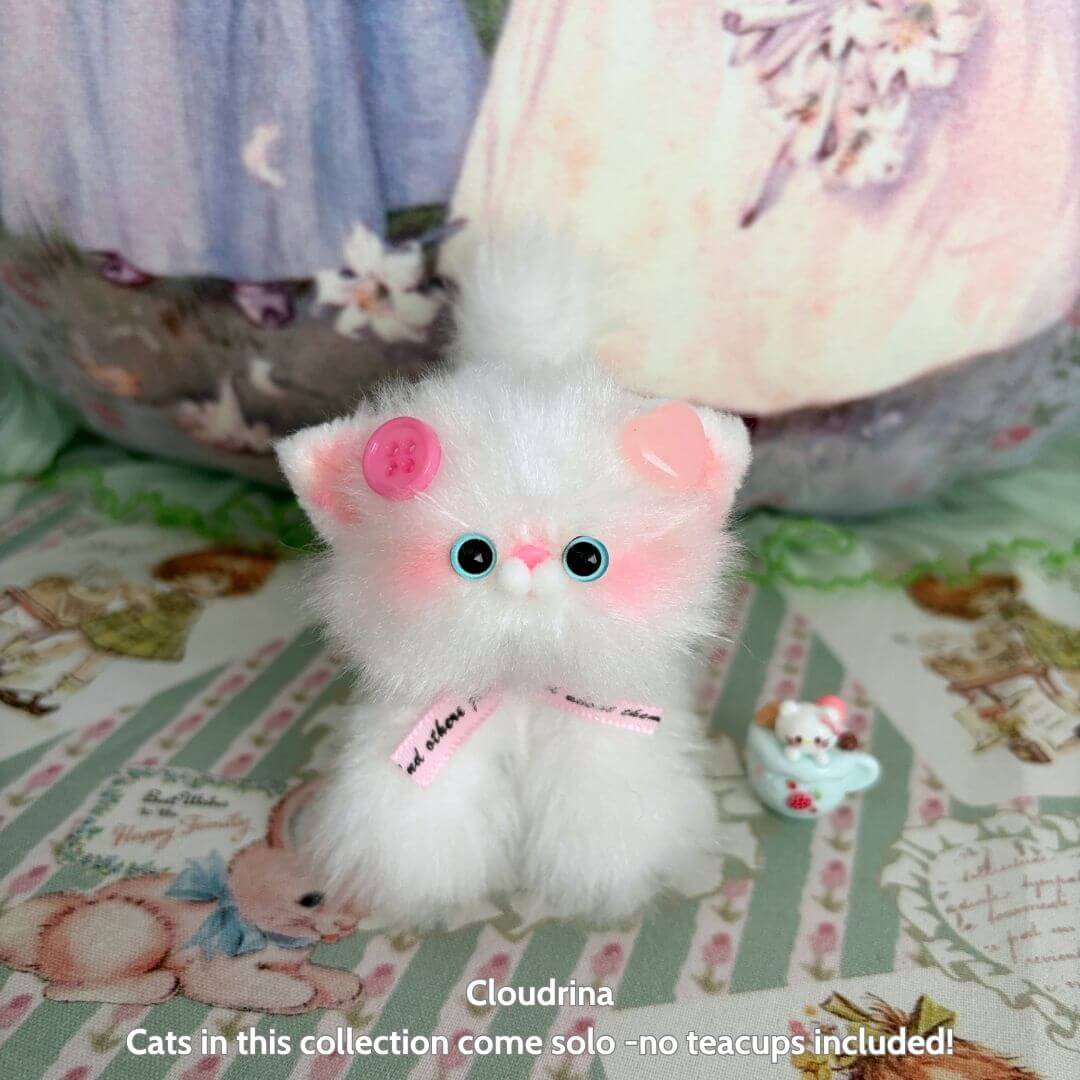 Handmade kitten from the Glossy Meowgic Collection, fluffy white cat figurine with pink cheeks, unique kawaii style.