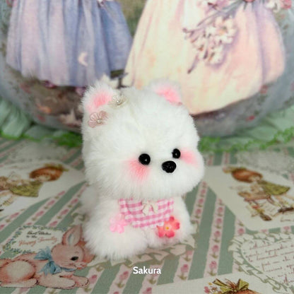 Cosplay Puppy Collection: fluffy white puppy doll with pink accents and floral decorations, cute collectible design.