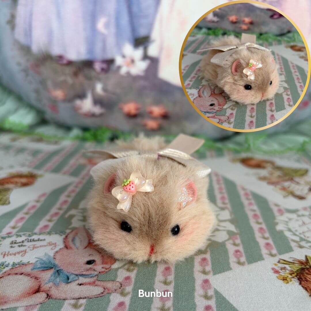 Lying Hamsters Figurines - fluffy beige hamster with a bow, soft pose, kawaii style, cute collectible decor.