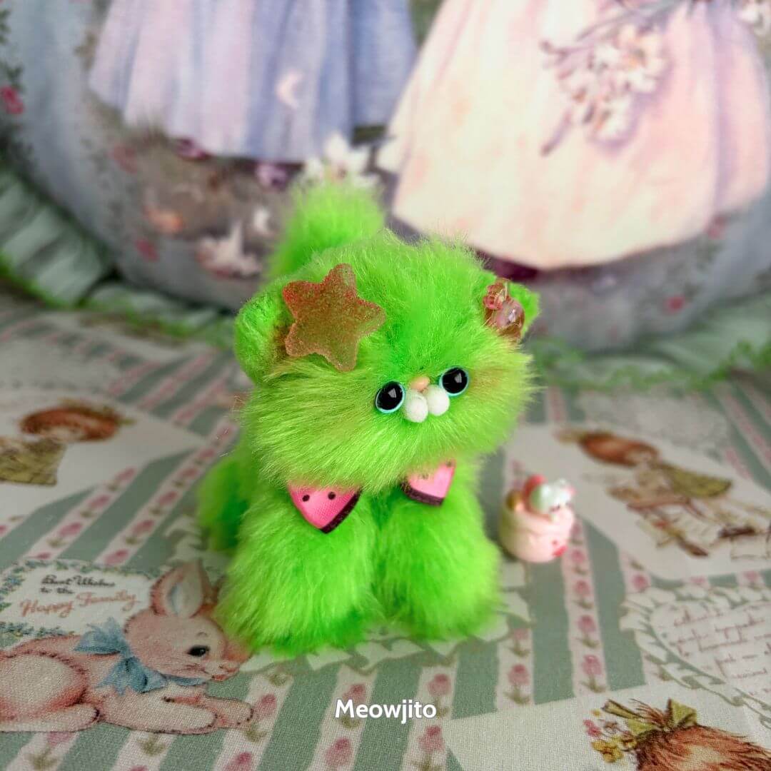 Glossy Meowgic Collection – Bright green fluffy kitten figurine with playful accessories, handmade in UK, kawaii style.