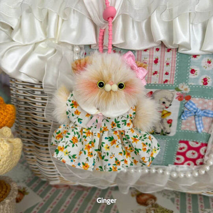 Pawsh Pendants: adorable fluffy kitten figurine in floral dress with pink bow, handmade in UK, cute collectible decor.