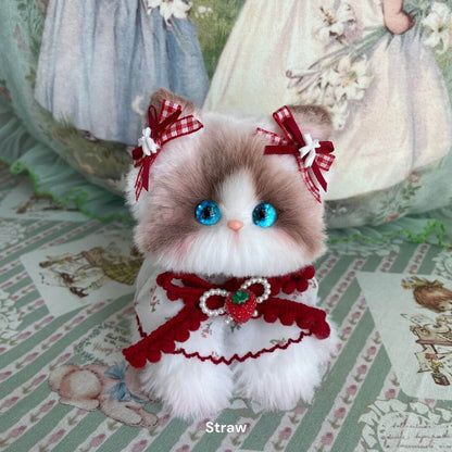 Handmade kitten from the Enchanted Big Paws Collection, fluffy cat figurine with blue eyes and cute red accessories.