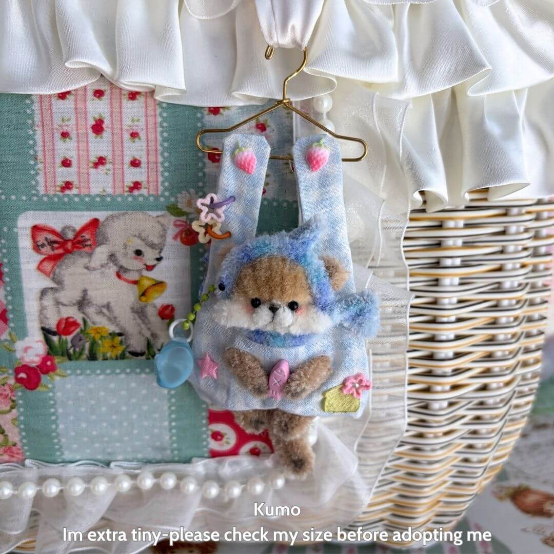 Cute handmade animal figurine, Little Hanger Pals, fluffy kitten in blue bunny outfit, miniature decor with playful charm.