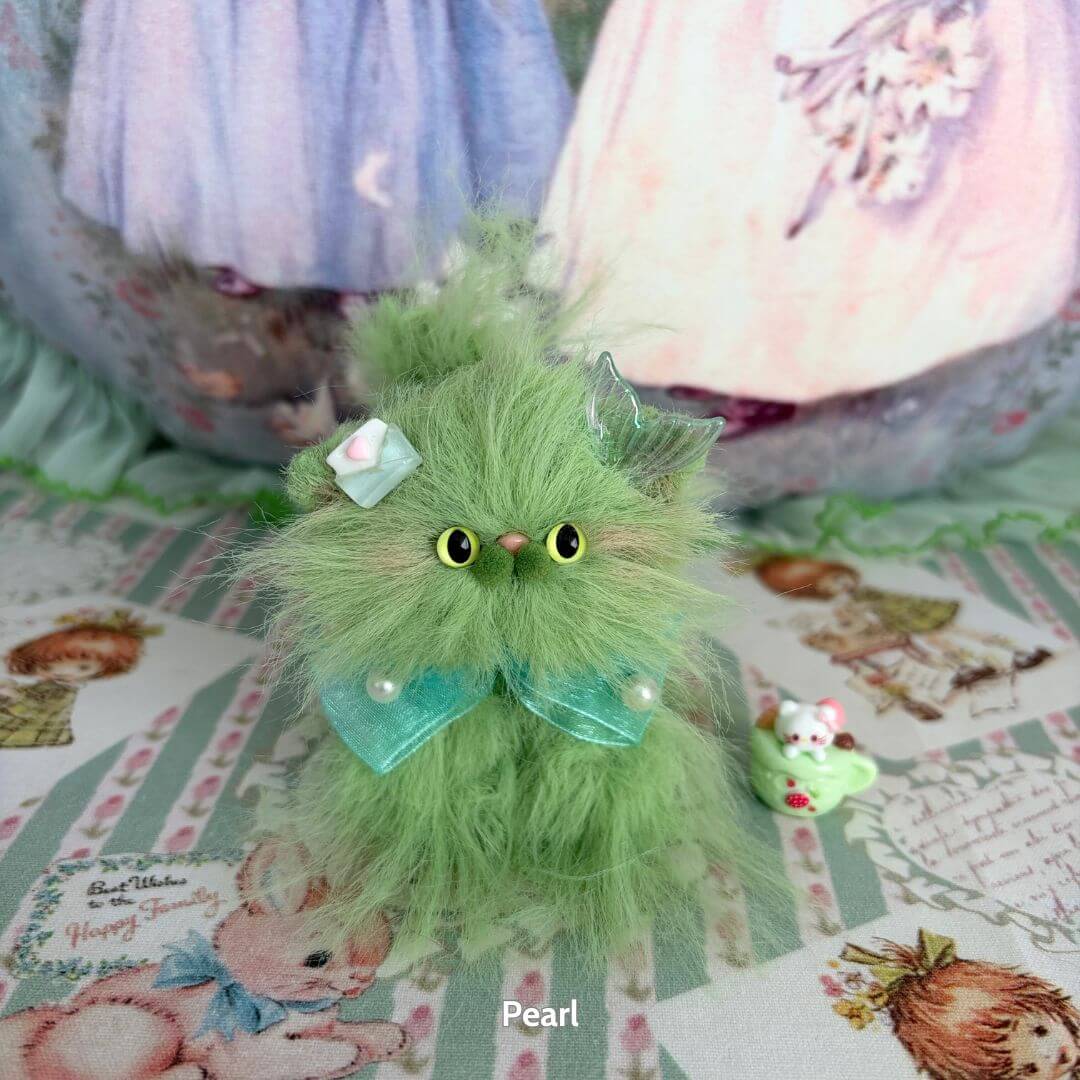 Fluffy green kawaii cat figurine from the Siberian Snuggles Collection with cute accessories and playful expression.