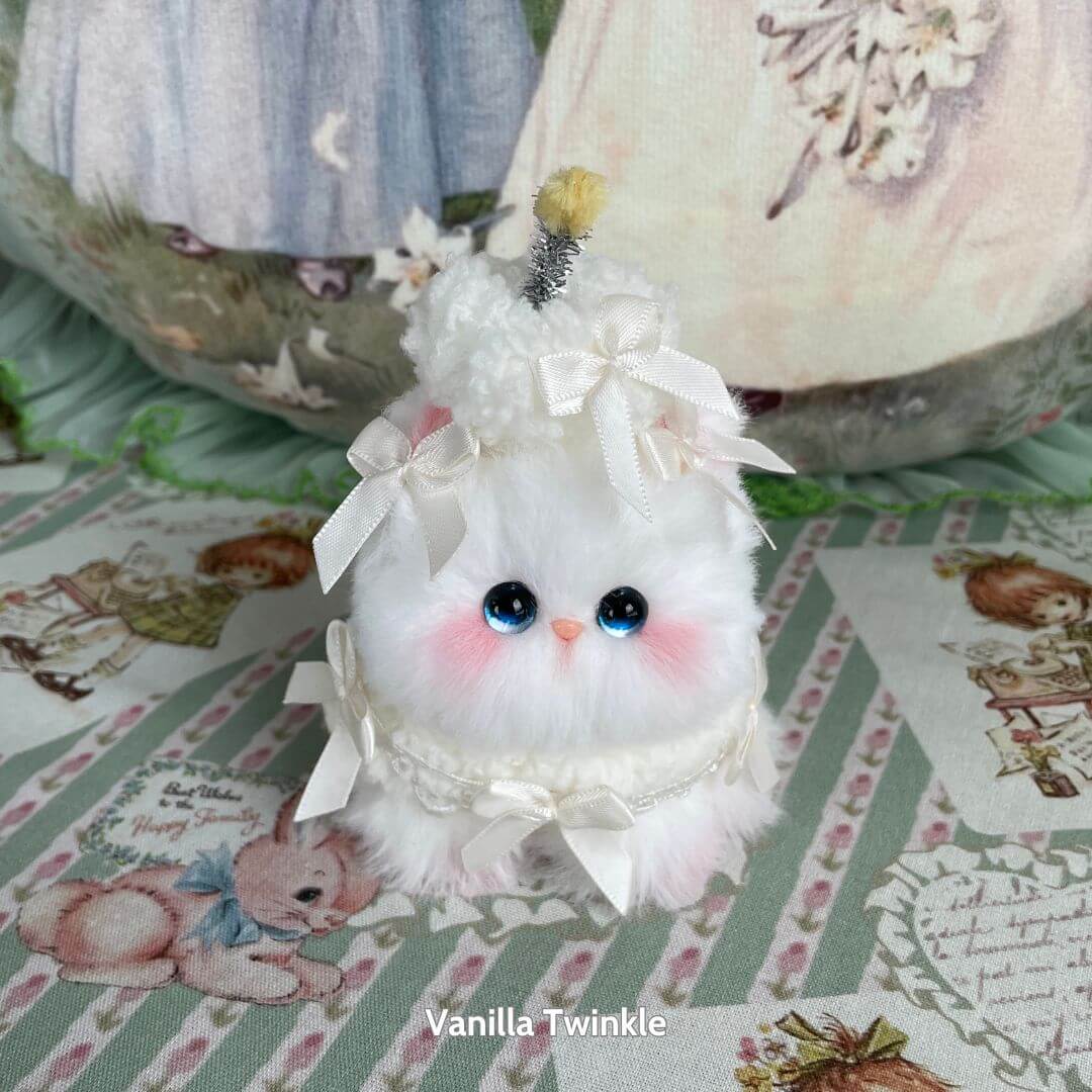 Mewlicious Collection handmade kitten, fluffy white cat figurine with blue eyes, dressed as a vanilla dessert, cute collectible decor.