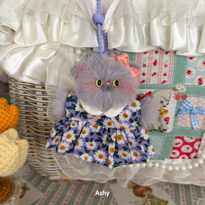 Pawsh Pendants featuring a fluffy kitten figurine dressed in a floral dress with a pink bow, handmade in UK, cute collectible.