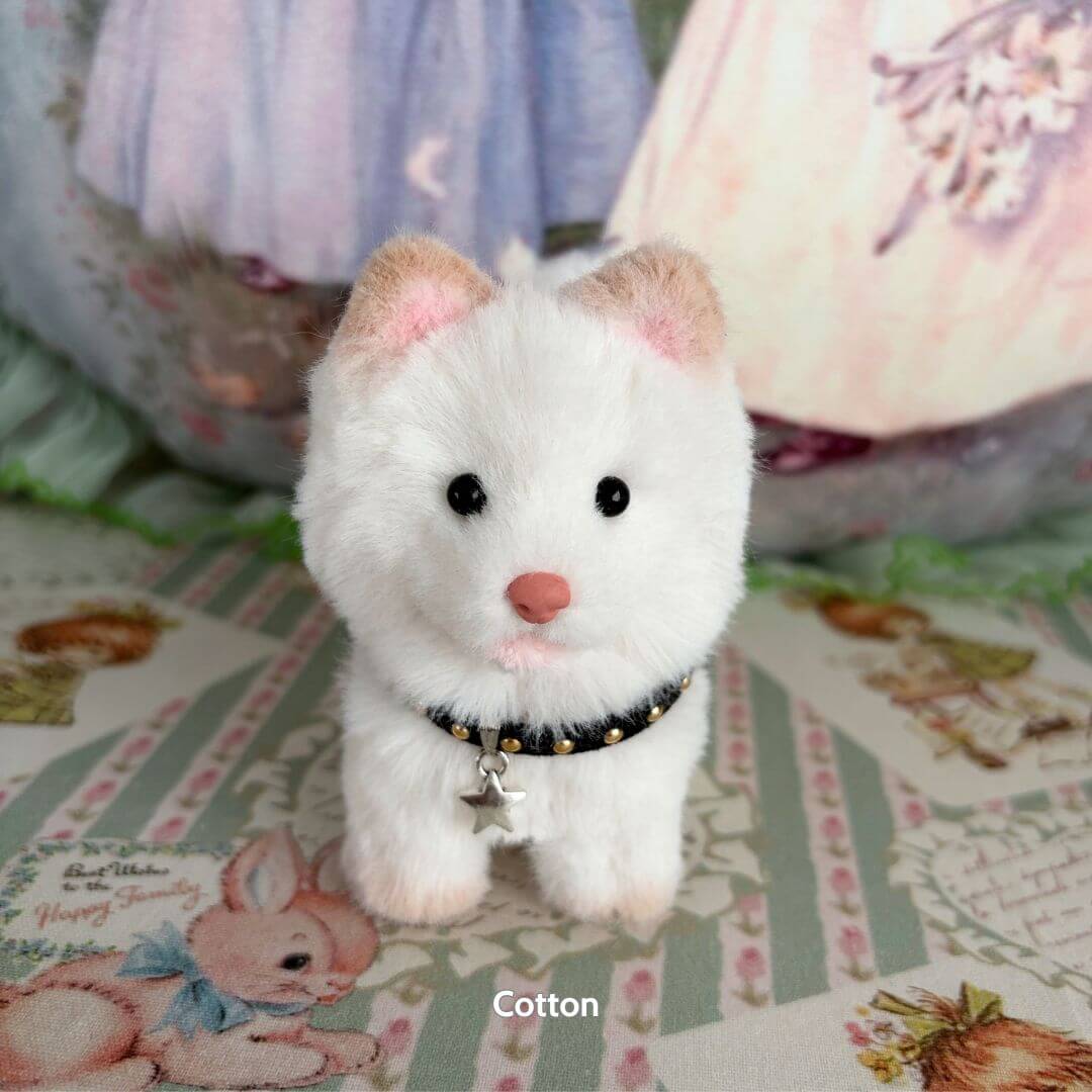 Lifelike Puppy Collection white fluffy puppy figurine wearing a star collar, handmade with soft textures and realistic details.