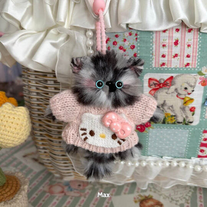 Pawsh Pendants: handmade kitten figurine with fluffy fur and pink outfit, featuring a cute bow, to elevate your collectible decor.