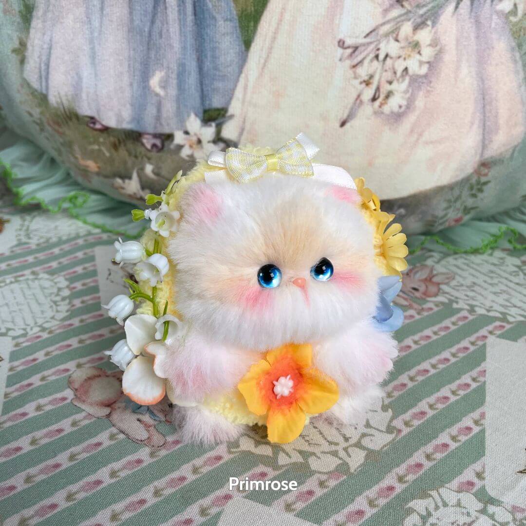 Adorable Blossom Kitten Collection handmade kitten figurine with fluffy white fur, floral accents, and a cute pose.