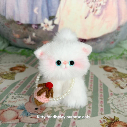 Adorable fluffy cat figurine with pearl necklace holding an ice cream cupcake, part of the Snuggle Bits collection.