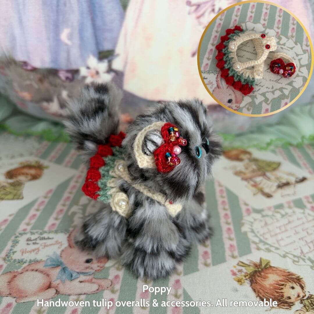 Handmade kitten from the Spring Love Limited Collection, featuring fluffy gray fur, cute red tulip overalls, and removable accessories.