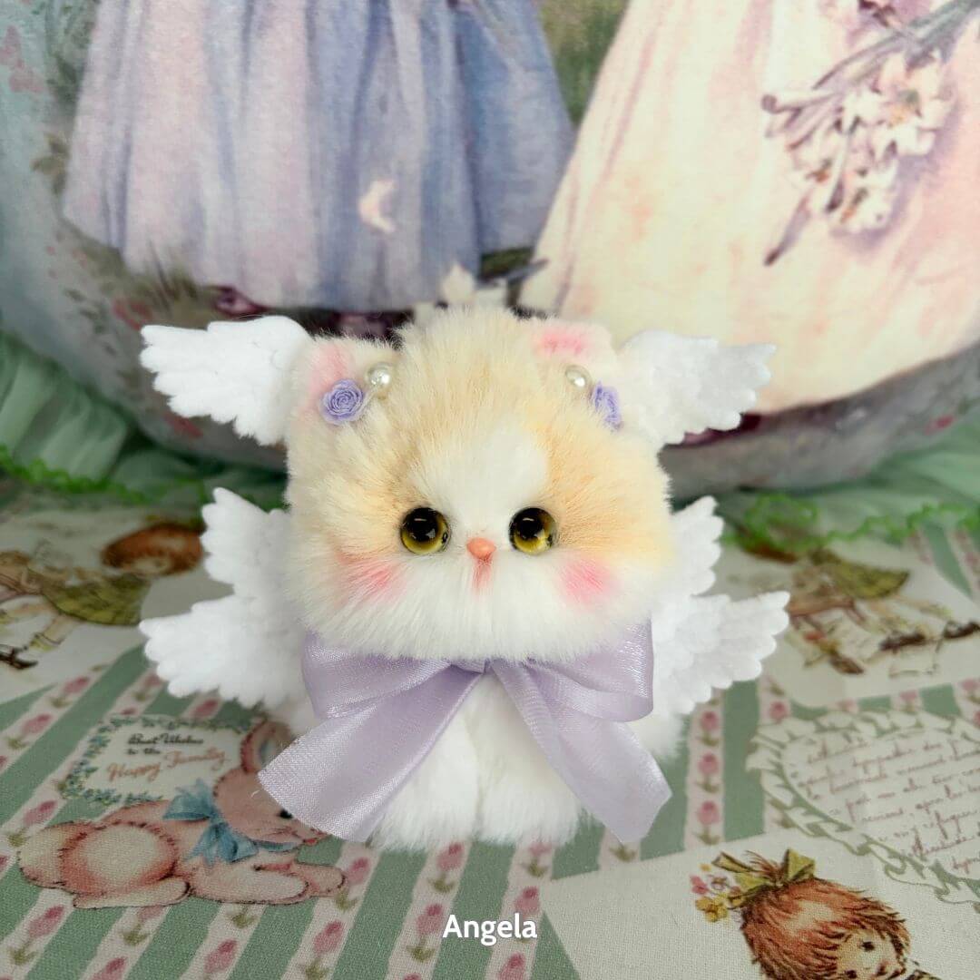 Handmade kitten from the Fairy Paws Collection, fluffy cat figurine with wings, pastel colors, cute animal collectible.
