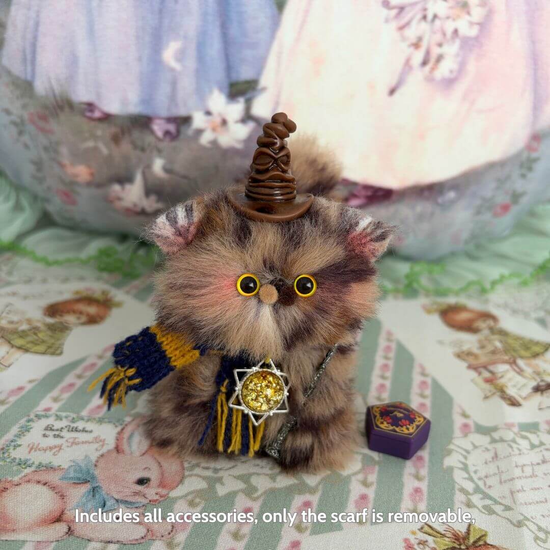 Handmade fluffy kitten with wizard hat and scarf, featuring a star pendant, representing a Magic Kitty Companion collectible.