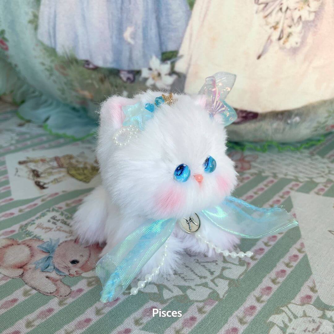 Handmade kitten from the Zodiac Kitten Collection, fluffy white with blue eyes and aqua ribbons, representing Pisces. Cute animal collectible.