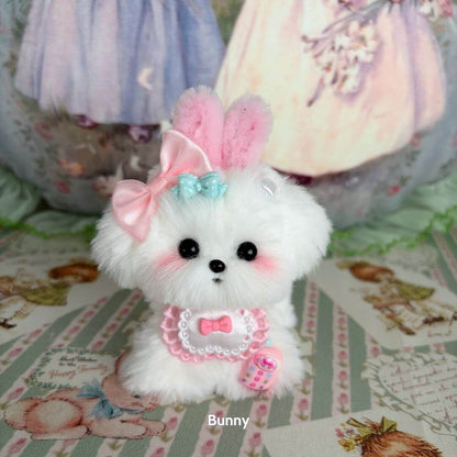Adorable handmade puppy from the Cosplay Puppy Collection, featuring fluffy white fur, pink bunny ears, and pastel accessories.