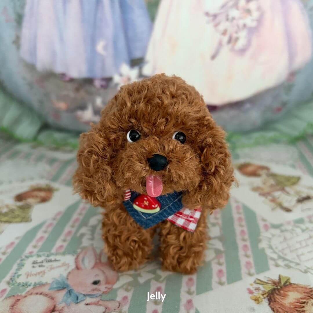 Lifelike Puppy Collection: adorable fluffy brown puppy figurine wearing a blue bandana with a cute strawberry, showcasing realistic details.