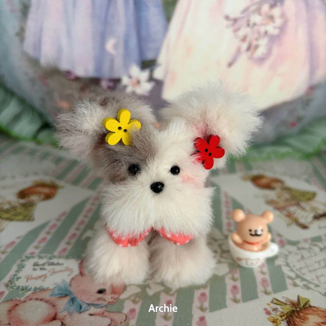 Adorable Puppy Collection: Fluffy handmade puppy figurine with grey and white fur, colorful flower accessories, posed cutely with a tiny bear.