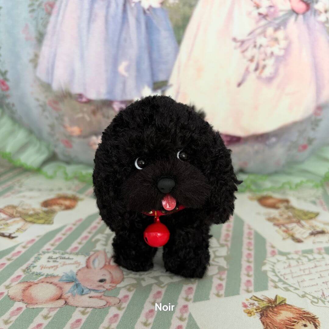 Lifelike Puppy Collection black fluffy puppy figurine with a red collar, showcasing realistic details and soft textures.