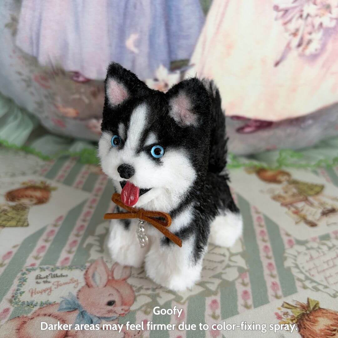 Lifelike Puppy Collection features a handmade black and white fluffy puppy with expressive blue eyes, wearing a stylish bow tie.