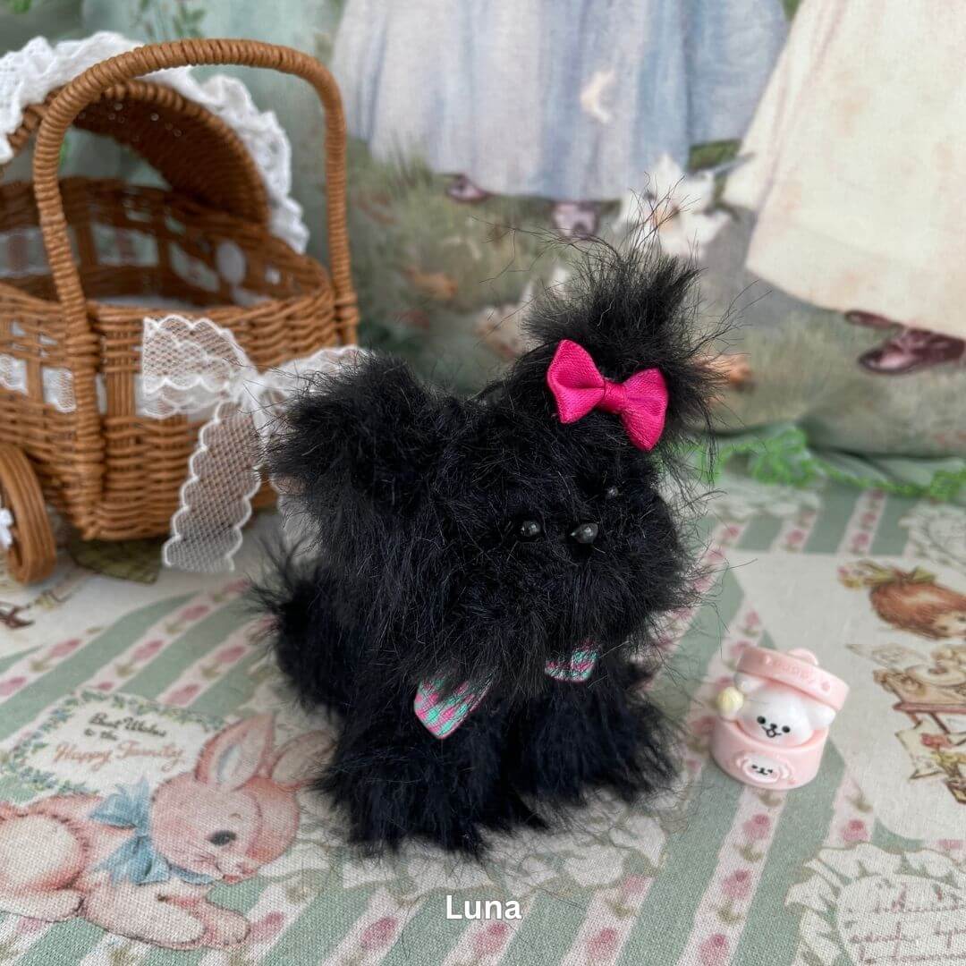 Handmade fluffy puppy plush toy with pink bow and dessert accessory, part of the Fluffy Puppy Collection, inspired by toy dog breeds.