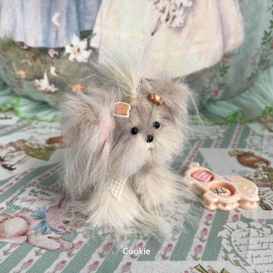 Handmade Fluffy Puppy Collection figurine featuring a grey long-haired toy dog with dessert-themed accessories.